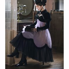 A light purple jumper skirt that creates a bewitching and mysterious atmosphere. A velvet ribbon hangs from the waist, and the hem is decorated with sheer lace. The back is decorated with lace and ribbon. 
 
 
 
 Size 
 
 S size 
 
 Length: 105cm 
 Bust: 84-98cm 
 Waist: 69-84cm 
 
 M size 
 
 Length: 107.5cm 
 Bust: 89-103cm 
 Waist: 74-89cm 
 
 L size 
 
 Length: 110cm 
 Bust: 94-108cm 
 Waist: 79-94cm 
 
 
 
 
 
 
 Material 
 
 Polyester 
 
 
 Model worn 
 
 Wearing size 
 
 S size 
 
 Model Purple Fairycore Dress With Ruffles, Purple Gothic Dress For Cosplay, Purple Gothic Dress For Costume Party, Gothic Purple Dress For Costume Party, Purple Ruffled Costume Dress, Purple Pastel Goth Party Dress, Purple Ruffled Dress For Costume, Purple Gothic Dresses With Ruffles, Pastel Goth Costume Dress