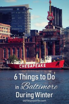 a red boat in the water near buildings and a sign that says 6 things to do in baltimore during winter