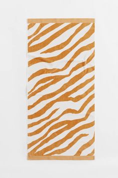 an orange and white zebra print napkin