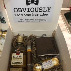 an open box with liquor and chocolates in it