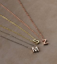 You can customize this necklace with a letter of your choice. All our necklaces are suitable for all kinds of clothing and add a great sparkle to your wardrobe.  #charmnecklace #choker #personalizednecklace #customnecklace #necklace #personalizedjewelry #customjewelry #pendant #birthdaygift #valentinedaygift #giftforher #namenecklace #initialnecklace #letternecklace #danglenecklace Dainty Customizable Initial Necklace For Personalized Gift, Customizable Dainty Initial Necklace For Personalized Gift, Customized Minimalist Initial Necklace As Personalized Gift, Customized Initial Pendant Necklace As A Gift For Her, Customized Minimalist Charm Necklace With Initial Pendant, Customized Initial Pendant Charm Necklace In Minimalist Style, Customized Minimalist Initial Pendant Charm Necklace, Minimalist Customized Initial Pendant Necklace, Customized Minimalist Initial Pendant Necklace