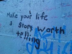 graffiti on the side of a building that says make your life a story tell work sing