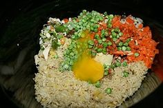 rice with peas, carrots and an egg on top