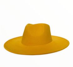 SAVANNAH WIDE BRIM FEDORA - YELLOW Introducing our new Savannah line of fedoras, which feature a highly requested large brim and a drop shaped crown. Handcrafted from a blend of wool and polyester materials Adjustable inner-headband to ensure the perfect fit Features a larger 3.75" brim Available in sizes: Medium 54-58cm and Large 58-60cm. FREE shipping on every order Western Style Solid Fedora For Spring, Flat Brim Fedora For Party, Spring Western Fedora, Party Fedora With Flat Brim, Party Fedora With Adjustable Flat Crown, Adjustable Flat Crown Fedora For Party, Spring Beach Felt Hat With Flat Crown, Yellow Fedora With Short Brim, Yellow Fitted Fedora With Short Brim