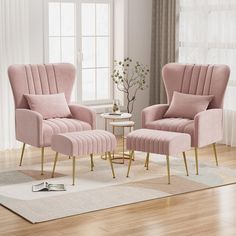 a living room with two pink chairs and a small table