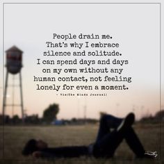 a person laying down in the grass with a water tower behind them and a quote about people drain me that is why i embrace