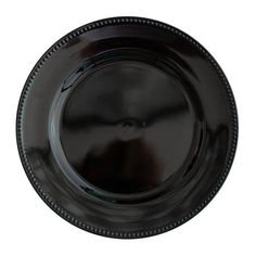 an empty black plate with beading on the rim and bottom, isolated against a white background