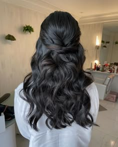 the back of a woman's head with long dark hair