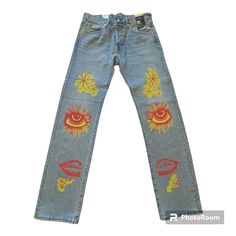 Groovy Retro Hippy Vibes With Painted Colorful Art On Front And Back Legs. Light Distressing And Fading. Levi's Tapered Leg Bottoms For Streetwear, Levi's Streetwear Bottoms With Five Pockets, Straight Leg Denim Bottoms With Graphic Print, Levi's Blue Bottoms For Streetwear, Blue Graphic Print Straight Leg Bottoms, Blue Straight Leg Bottoms With Graphic Print, Summer Straight Leg Bottoms With Graphic Print, Summer Graphic Print Straight Leg Bottoms, Levi's Straight Leg Summer Pants