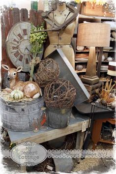 an old fashion shop with mannequins, baskets and other items on display