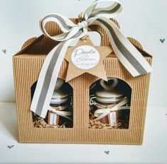 an open box with two jars in it and a ribbon around the top that says peace