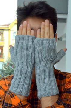 This Gray Men Arm Warmers  , made with soft alpaca and  acrylic yarn in color Grey ,  it is very attractive for boho style lovers. Great for use in a cold office, using the computer , working outdoors or while you drink your favorite hot drink . These knit mittens keep your hand warm and allowing your fingers the freedom to do what they need.   With the winter unisex fingerless  glove  and the durable material, this long fingerless  can be great as a  gift for him and best friend to be used as c Casual Hand Knitted Gray Knitting Pattern, Casual Gray Hand Knitted Pattern, Casual Gray Knitting Pattern, Casual Alpaca Knitting Pattern, Knit Wrist Warmers, Knitted Wrist Warmer, Warmest Winter Gloves, Gray Winter, Trendy Winter