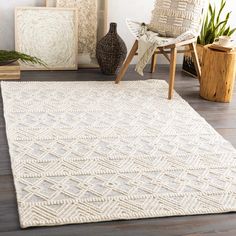 a large white rug in the middle of a room