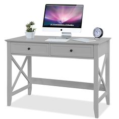 a white desk with a computer on it