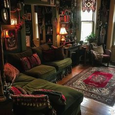 a living room filled with lots of furniture and decor