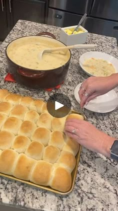 a person is making bread in the kitchen with other food items on the counter top