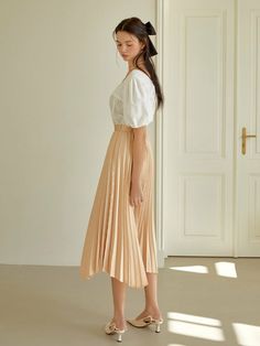 Editor's Notes Classy and casual design style long pleated skirt that has a feminine wear. It has a comfortable wear with a stylish fit that is great to style in many different ways.- Feminine mood pleats skirt- Polished detail wear that has a luxurious wear- Unbalanced hem design style- Slim comfortable fit when worn Measurements(in.)S / M- Waist: 12.99 in. / 13.98 in. - Hip: 21.06 in. / 21.26 in- Total Length: 31.10 in. - 34 Spring Pleated Wide-leg Skirt, Spring Wide-leg Pleated Skirt, Beige Pleated Maxi Skirt For Summer, Spring Wide Leg Pleated Skirt, Summer Beige Pleated Maxi Skirt, Flowy Long Pleated Skirt For Day Out, Feminine Pleated Long Skirt, Relaxed Pleated Skirt For Day Out, Casual Pleated Midi-length Maxi Skirt