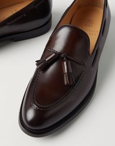 Aged calfskin loafers with tassels The timeless elegance of the loafer is enriched with the excellence of Brunello Cucinelli materials. Careful craftsmanship provides the antiqued calfskin with special shading that defines the footwear’s vintage feel, completed by the distinct tassels detail. A leather and rubber outsole ensures comfort. Calf Leather Tassel Loafers With Leather Sole For Galas, Elegant Wingtip Tassel Loafers For Galas, Timeless Tassel Loafers With Leather Sole For Business, Luxury Italian Tassel Loafers For Formal Occasions, Luxury Wingtip Tassel Loafers For Business, Timeless Wingtip Tassel Loafers For Business, Luxury Goodyear Welted Loafers For Galas, Luxury Goodyear Welted Tassel Loafers For Business, Timeless Wingtip Tassel Loafers For Formal Occasions