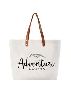 the adventure awaits canvas tote bag is shown in white with brown leather handles