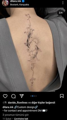 the back of a woman's neck with a tattoo design on her left side