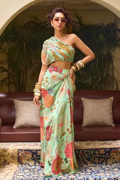 Mint green draped skirt with floral print. Comes with padded pleated blouse embellished by sequins. - Aza Fashions Summer Floral Print Saree Set, Green Draped Party Sets, Green Silk Dresses With Flowy Skirt, Green Printed Sleeveless Set, Sleeveless Green Printed Sets, Draped Silk Sets For Summer, Elegant Green Ruched Skirt, Chic Green Floral Print Sets, Green Saree Dress For Spring