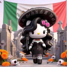 a hello kitty doll wearing a sombrero and standing in front of a cemetery