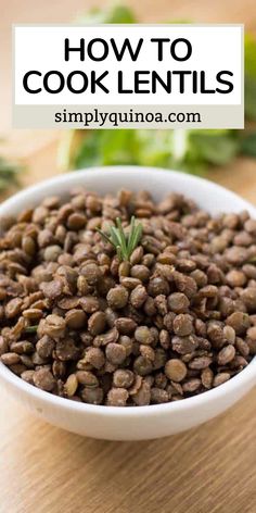 a white bowl filled with lentils on top of a wooden table