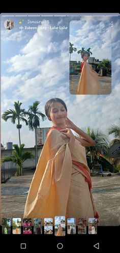 the woman is wearing an orange dress and talking on her cell phone while standing in front of palm trees