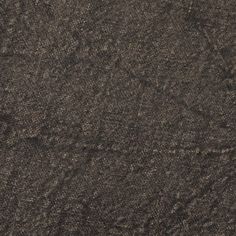 an upholstered fabric textured in dark brown