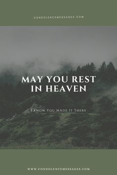 the words may you rest in heaven on top of a hill with fog and trees