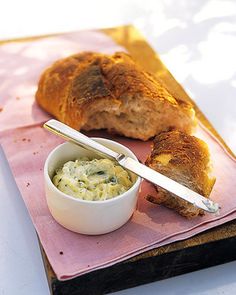 bread and dip on a pink napkin with a spoon next to it in a bowl