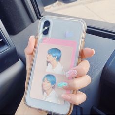 a person holding up a cell phone case with an image of a boy on it