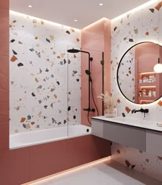 a modern bathroom with pink walls and white counter tops, an oval mirror on the wall