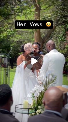 the bride and groom are kissing at their wedding