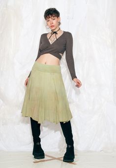 Reworked Y2K vintage midi skirt in overdyed green. We even added little bows to the waist. Made in Italy Recommended size: EU 36-40 Features: - stretchy waist - 100% cotton - dobule-layered - reworked Every item we manage is cleaned and, when necessary, repaired, ensuring it arrives to you in top condition. Our model, Panna is 171 cm / 66.7" tall and she's a size S. Size: One size / US null / UK null / IT null Measurements:  waist (seam to seam) (min): 36 cm / 14.0" waist (seam to seam) (max): 4 Fairycore Grunge, Frilly Skirt, Y2k Vintage, Vintage Y2k, Favorite Outfit, Midi Skirt, Womens Skirt, Bathing Beauties, In Italy