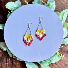 KC Chiefs red, yellow and white ombré fringe earring. Hand beaded with ToHo beads on Sterling silver teardrop hoop and ear wire. Chiefs Earrings Cricut, Kc Chiefs Beaded Earrings, Fire Color Beaded Earrings, Chiefs Earrings, Chiefs Leather Earrings, Ombre Fringe Earrings, Teardrop Hoop Earrings, Fringe Earring, Toho Beads