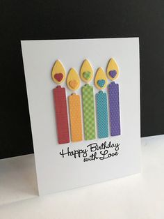 a birthday card with three candles on it