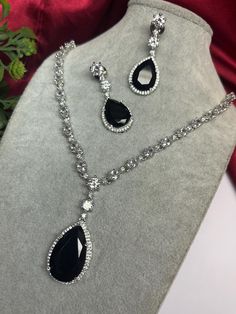 Gorgeous fine quality imitation jewellery  CZ black with CZ diamonds studded necklace with white gold rhodium plating and matching Earrings Item contains: Necklace and earrings AAA quality cubic zirconia used. Highest quality and craftsmanship Necklace Fitting is adjustable Earrings Closure: Pushback Necklace Closure: chain with Hook Details-  -Handmade item -Delivery from a small business in India -Materials: white rhodium, stones, cz, zircon, American diamond -Jewellery type: Earrings, Necklace -Style: Art deco *CARE INSTRUCTION* You can use Jewelry for years together with the help of below jewelry care instructions. * Protect from sharp blows/scratches and extreme temperature. * Avoid contact with perfumes, sprays, chemicals and water. * Keep in a clean, dry and airtight Zip-pouch. * Wi Luxury Black Spinel Necklaces For Formal Occasions, Necklace Closure, American Diamond Jewellery, Zirconia Necklace, Studded Necklace, Jewelry Care Instructions, Cz Necklace, Cz Jewelry, Wedding Jewellery Necklace