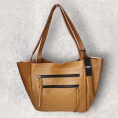 Botkier Genuine Leather Chelsea Tote New With Tags Color: Coffee (Cognac) Pebbled Leather Dark Brown Metal Hardware With Long Pulls Two Exterior Pockets Large Interior Zip Pocket Two Card Slots Interior Is Metallic Copper Leather. Two Top Handles, Drop 9" Magnetic Closure Measures: 17" X 11" X 4" Large Leather Tote Bag, Brown Leather Totes, Top Handbags, Nylon Tote Bags, Large Leather Tote, Metallic Copper, Color Coffee, Nylon Tote, Shopper Tote