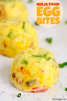 two egg bites on a white plate with green garnish and text overlay that reads, ninja foodie egg bites