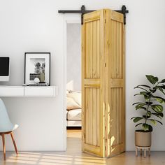 an open wooden door in the corner of a room with a computer desk and chair