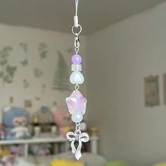 a wind chime hanging from a ceiling in a room