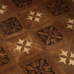 a wooden floor with decorative designs on it