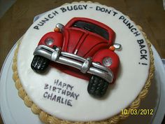 a birthday cake with a red car on it