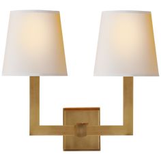 a wall light with two lamps on each side and a white shade in the middle