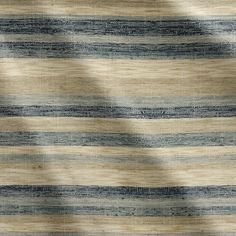 an area rug with blue and beige stripes