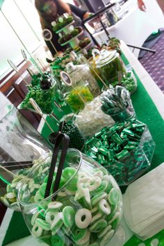 green and white candies are on display at a st patrick's day party