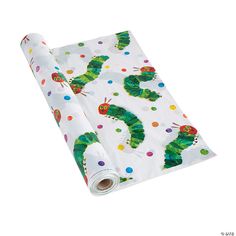 the very hungry caterpillars wrapping paper is rolled up on a white background