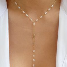 Material: gold plated brass Length: 17" + 3" extension Drop: 4.75" IMPORTED White Adjustable Choker Jewelry, Adjustable White 14k Gold Filled Necklaces, Adjustable White 14k Gold-filled Necklace, White 14k Gold-filled Clavicle Chain Necklace, White 14k Gold Filled Clavicle Chain Necklace, 14k Gold Filled White Clavicle Necklace, Trendy White Gold Plated Necklace, Adjustable White Lariat Necklace With Delicate Chain, White Adjustable Clavicle Chain Necklace