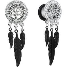 pair of black and white earrings with tree of life on the front, hanging from an acrylic hook